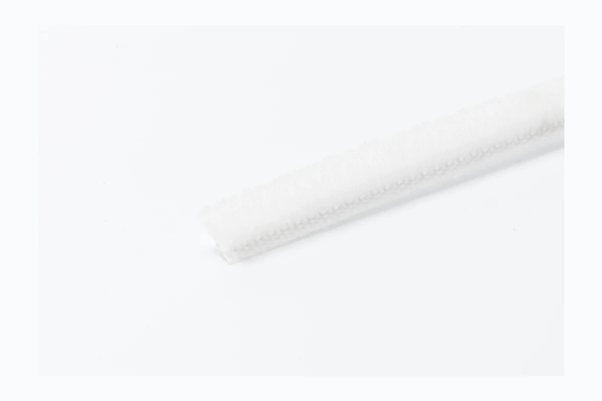 White sliding window brush seal sample for aluminum window tracks